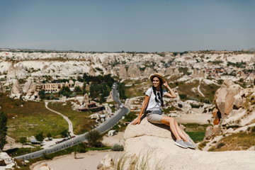 Turkey Cappadocia, Rock Formations in Pasabag Monks Valley, Cappadocia, Turkey, woman by the caves