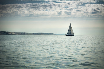 Yacht heading out to sea on Sussex coast