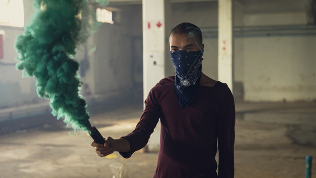 Young man inside an empty warehouse - Powered by Adobe