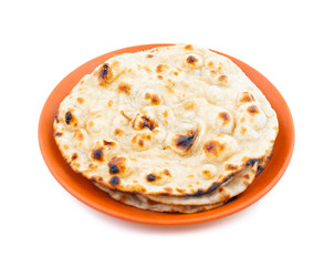 Indian Cuisine - Tandoori Roti whole wheat flat bread made from stoneground wholemeal flour, Traditionally known as atta, and water that is combined into a dough
