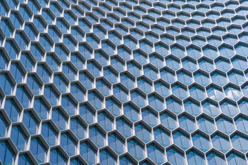 Office buildings. Structure of hexagon windows in futuristic technology network connection concept....