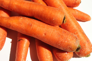 Background with carrots isolated on a white. Food background
