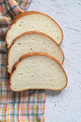 Bread sliced on gray stone
