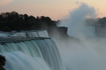 Close up of Niagara Falls in evening as seen from USA, with water flow all blurred