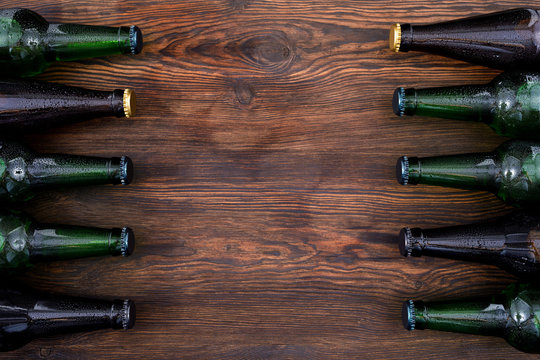 Different Beer Bottles On Wooden Table . Top View