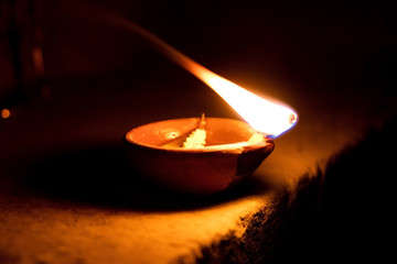 Traditional clay diya lamps lit during diwali celebration