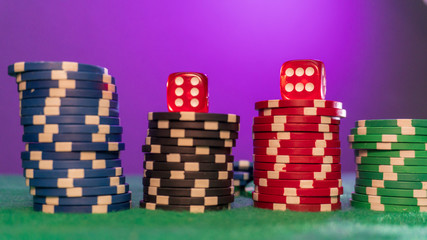 poker chips, dice on table close up