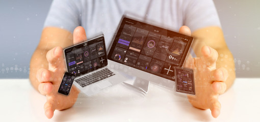 Businessman holding Devices connected to a cloud multimedia network 3d rendering