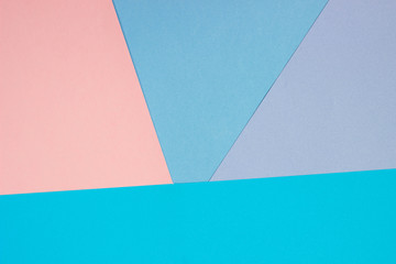 Abstract geometric background made of paper. Pink and blue paper, template for adding text.