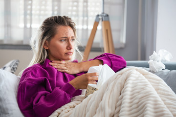 Cold And Flu. Portrait Of Ill Woman Caught Cold, Feeling Sick And Sneezing In Paper Wipe. Closeup Of Beautiful Unhealthy Girl Covered In Blanket Wiping Nose. Healthcare Concept. High Resolution