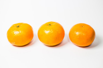 fresh oranges isolated on white background