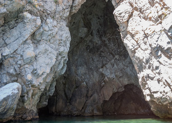 Entrance to the cave in the Black Sea in the Crimea in the beginning of summer