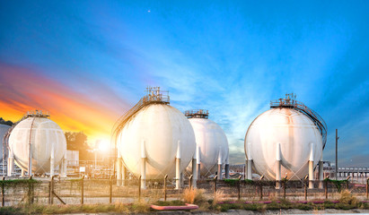 Oil and gas refinery storage tank at sunset,Industrial petrochemical plant.