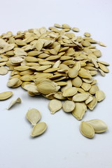 pile of pumpkin seeds isolated on white background