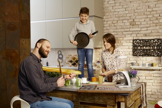 Family having fun in kitchen