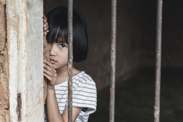 little girl hold cage with eye sad and hopeless, Human trafficking concept, human rights...