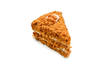 Peace of honey cake isolated on white background.