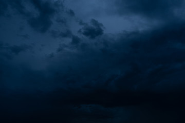 Naklejka na ściany i meble Dramatic stormy dark cloudy sky, natural photo background