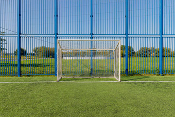 soccer empty gate on green grass field