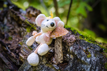 Birch mushroom in the forest, with a toy mouse-the symbol of 2020