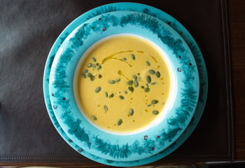 pumpkin soup with three shrimps sprinkled with pumpkin seeds. Served at an altitude of 2320m in one of the restaurants on the Aibga mountain range (Western Caucasus)