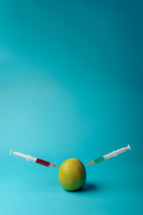 Chemical additives in food or genetically modified fruit concept.