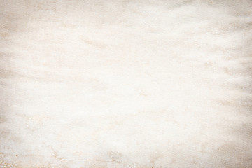 Old brown and white paper stained with coffee. Vintage abstract background.