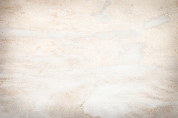 Old brown and white paper stained with coffee. Vintage abstract background.