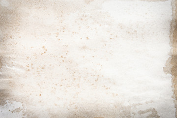 Old brown and white paper stained with coffee. Vintage abstract background.
