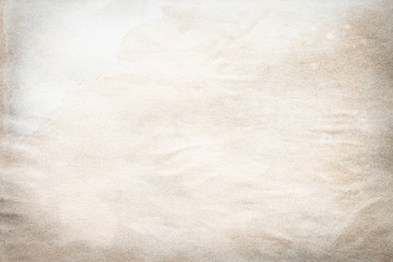 Old brown and white paper stained with coffee. Vintage abstract background.