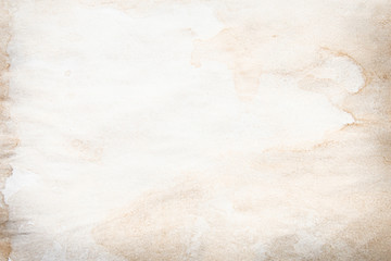 Old brown and white paper stained with coffee. Vintage abstract background.