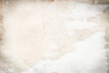 Old brown and white paper stained with coffee. Vintage abstract background.