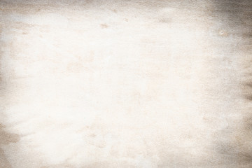 Old brown and white paper stained with coffee. Vintage abstract background.