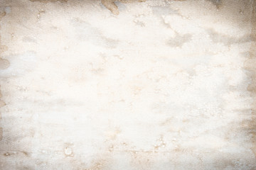 Old brown and white paper stained with coffee. Vintage abstract background.