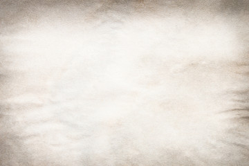 Old brown and white paper stained with coffee. Vintage abstract background.