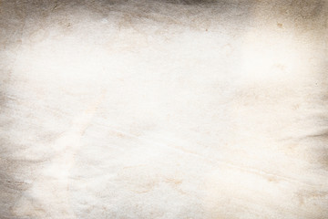 Old brown and white paper stained with coffee. Vintage abstract background.