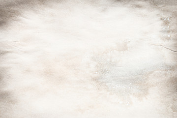 Old brown and white paper stained with coffee. Vintage abstract background.