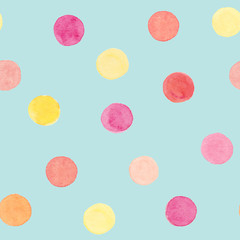 Watercolor hand drawn polka dots seamless pattern in peach color with pink, yellow, orange circles on blue background 