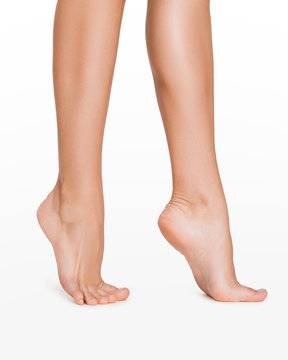 Perfect smooth legs. Woman stepping, on white