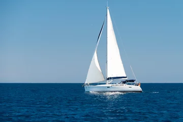 Foto auf Acrylglas a sailingboat at sea outside the coast of Corsica © Eline