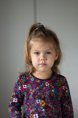 Portrait of cute little girl on the white background