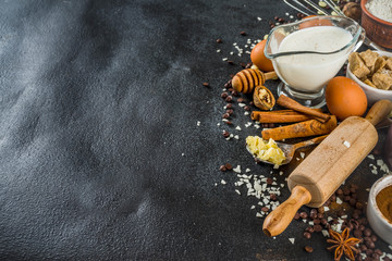 Ingredients for autumn winter festive baking - flour, brown sugar, eggs, chocolate drops, butter,...