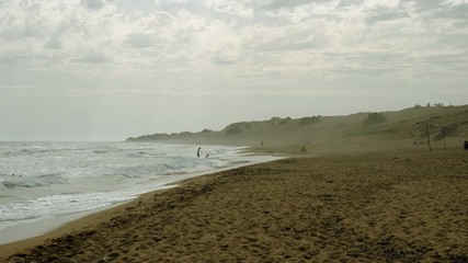 Seascape. Great waves breaking on sandy shore of stormy Mediterranean sea. Greece. 4K