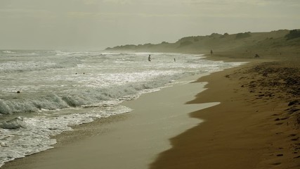 Seascape. Great waves breaking on sandy shore of stormy Mediterranean sea. Greece. 4K