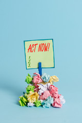 Conceptual hand writing showing Act Now. Concept meaning fulfil the function or serve the purpose of Take action Do something Reminder pile colored crumpled paper clothespin wooden space