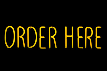 Image of yellow Order here neon sign