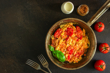scrambled eggs with tomatoes - breakfast delicious and healthy, menu concept. food background. copy space - obrazy, fototapety, plakaty
