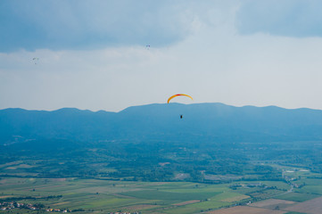 Paraglider flying. Sunset. Top view. Dream to fly
