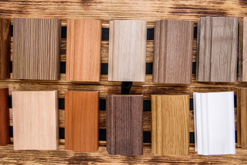 Pieces of planks on wooden background close up