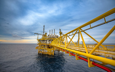 Offshore oil and gas rig platform with beautiful sky in the gulf of Thailand.